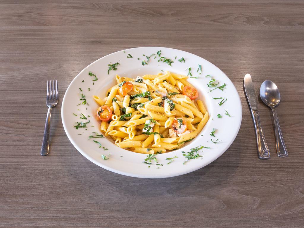 Basil Instinct Pasta · Penne pasta with cherry tomatoes, mozzarella, basil, crushed pepper, olive oil, and Parmesan.