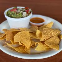 Chips and Guacamole · Fresh homemade guacamole topped with pico de gallo and and served with homemade corn tortill...