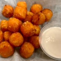 Sweet Potato Tots · Served with marshmallow sauce.