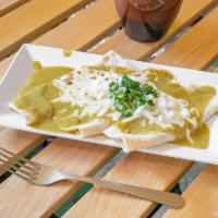 Enchiladas Suizas · Creamy tomatillo sauce topped with melted cheese, onions and cilantro.