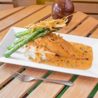 Salmon a la Parilla · Grilled filet of salmon with mashed potatoes, asparagus and lobster chipotle sauce garnish w...