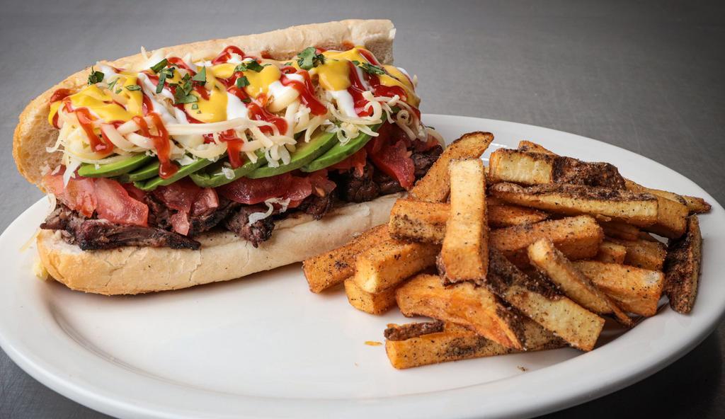 L Sandwich · Filled with grilled skirt steak with pico de Gallo, Avocados, Cheese, Mayo, Ketchup, Mustard and seasoned fries!