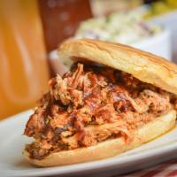 Pulled Pork Sandwich Combo · Slow-cooked Hickory smoked pork shoulder pulled from the bone. Served on a brioche bun and t...