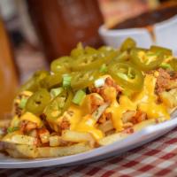 Loaded French Fries · French fries covered with choice of meat topped with BBQ sauce, nacho cheese, green onions a...