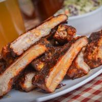 Smoked St. Louis Ribs Dinner · 4 ribs.  Meaty and delicious St. Louis-style ribs and smoked to perfection. Served with 2 si...