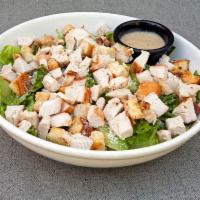 Grilled Chicken Caesar Salad · Our classic Caesar salad topped with 2 fresh grilled chicken breasts.