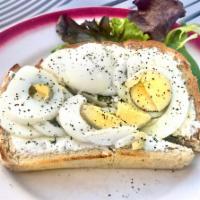 The Queen Toast · Open faced toast, our house baked multigrain bread, with dill cream cheese and sliced boiled...