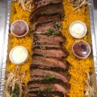 KING TUT PLATTER (Brisket) · Hummus, bread, 2 salad, 10 pieces brisket served over yellow rice and onions.