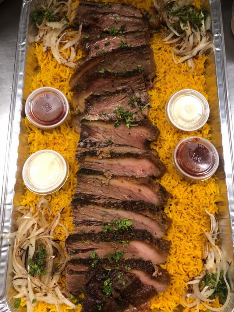 KING TUT PLATTER (Brisket) · Hummus, bread, 2 salad, 10 pieces brisket served over yellow rice and onions.