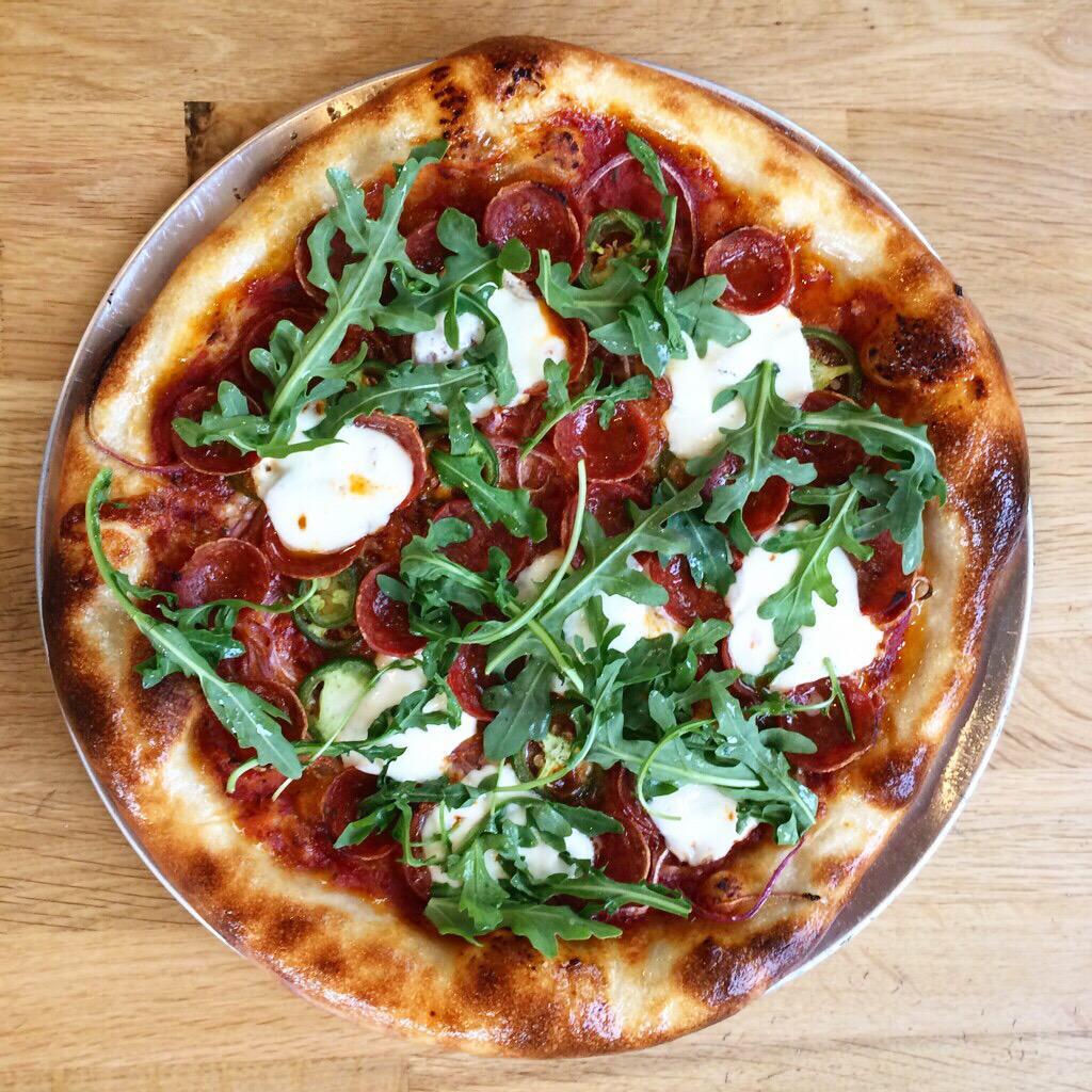 Brooklyn Bee Pizza · Pepperoni cups, sliced jalapenos, shaved red onion, fresh mozzarella, arugula, hot honey drizzle. Substitute gluten free crust for an additional charge.