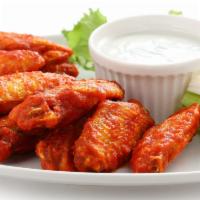 Buffalo Chicken Wings · Served with bleu cheese & celery sticks.