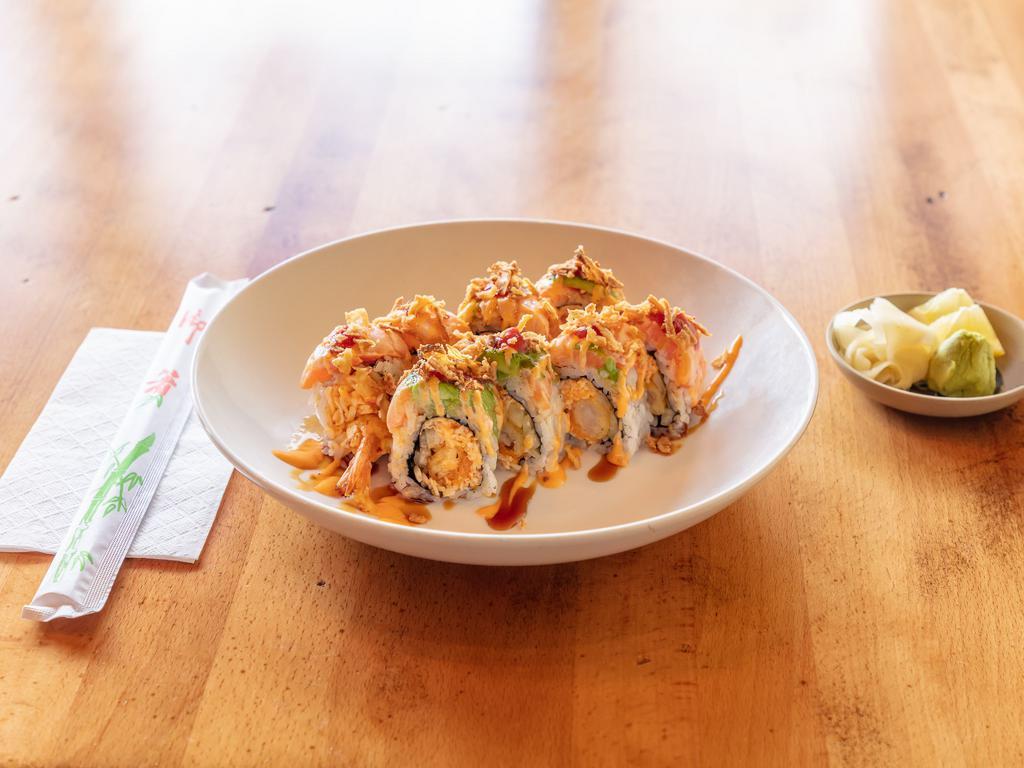 Lion King Roll · Spicy crab, shrimp tempura, cucumber, avocado, torched salmon, crunch onion with eel, spicy mayo, hot, sauce, lime juice.