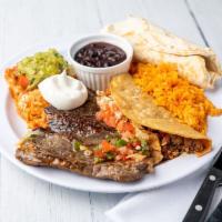 Steak Tampiquena · A skirt steak, cheese enchilada and beef taco garnished with guacamole and pico de gallo.