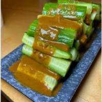 Cucumber Salad · With sesame sauce.
