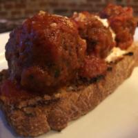 Polpettine · Beef and spinach meatballs stewed in tomato gravy, whipped ricotta, crostini.