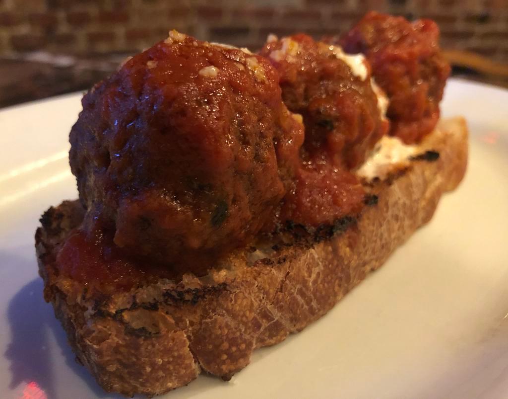 Polpettine · Beef and spinach meatballs stewed in tomato gravy, whipped ricotta, crostini.