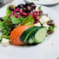 Greek Salad · Mixed greens, tomato, cucumber, red onion, feta cheese, Kalamata olives and oregano with bal...