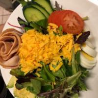 Chef's Salad · Mixed greens, turkey, ham, salami, tomato, cucumber, hard boiled egg and cheddar with balsam...