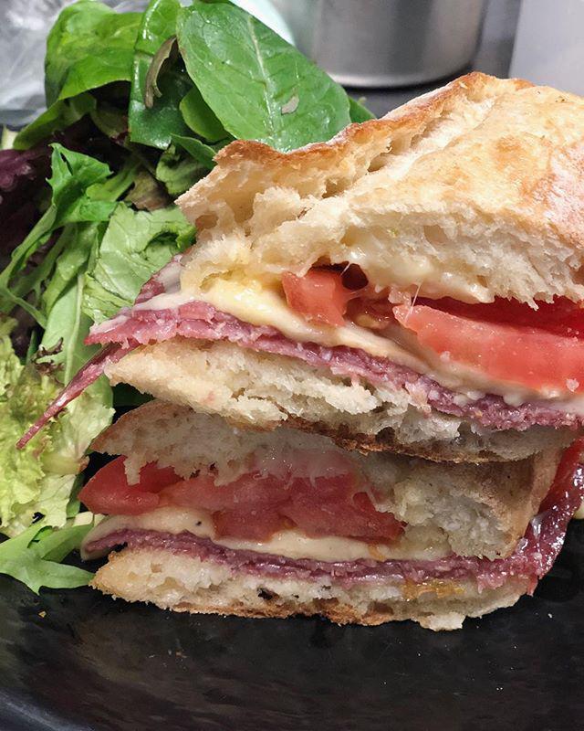 Salami baguette  Sandwich · Genoa salami, tomato, Swiss cheese and butter on a French baguette.