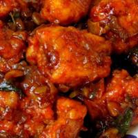 Chili Chicken · Chicken cooked with onion and bell peppers in a chili garlic sauce.