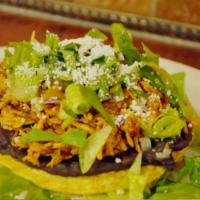 Tostadas · A crispy-fried corn tortilla topped with black beans, lettuce, shredded cheese, crema Mexica...