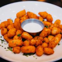 Wisconsin White Cheddar Cheese Curds · 1 lb. white cheddar Wisconsin cheese curds served with marinara.