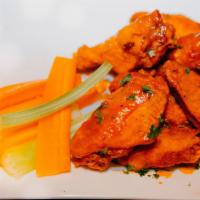 Chicken Wings · 8 Jumbo chicken wings, oven baked or deep fried, tossed in your choice of wing sauce, served...