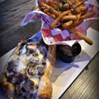 Italian Beef Sandwich · Served on French sub. Served with a side order of fries, pickle, and coleslaw.