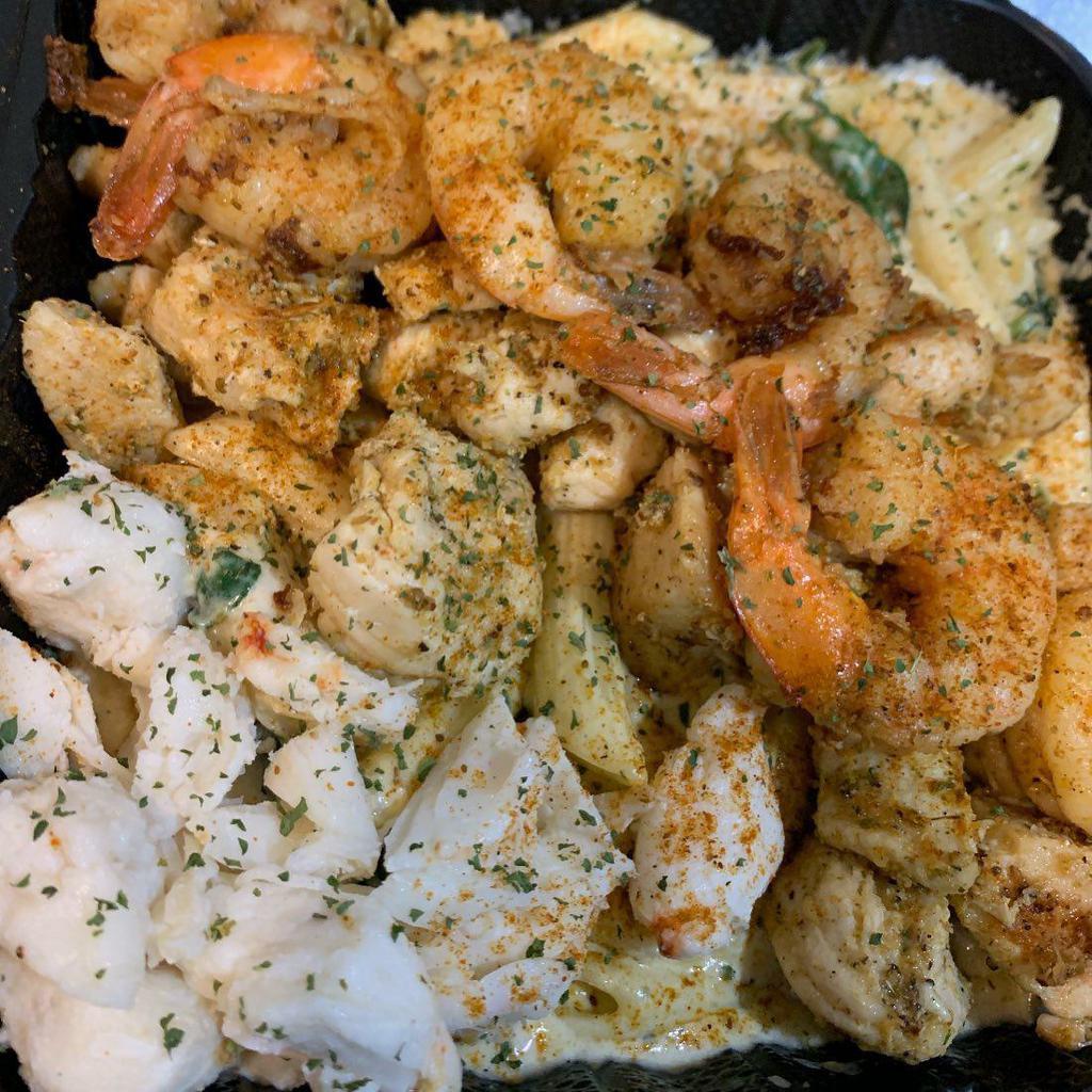 Chicken & Shrimp Pasta · Grilled chicken and grilled shrimp creamy Alfredo pasta, sauteed spinach, and penne pasta noodles.