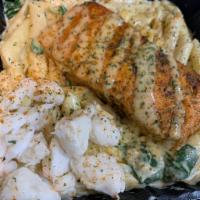 Salmon Pasta · Grilled salmon creamy Alfredo pasta, sauteed spinach, and penne pasta noodles.