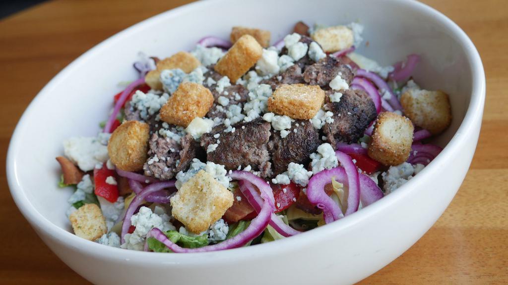 Wagyu Burger Salad · 1/2 lb. grilled American Wagyu *beef patty |
chopped mixed greens | roasted red bell
peppers | pickled red onion | crumbled
blue cheese | chopped smoked bacon |
artichoke heart | garlic croutons |
artichoke garlic dressing