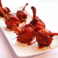 Chicken Lollipops · Marinated chicken wings deep-fried sauteed with spice and herbs.