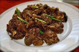 Chef’s Special Mamsam Vepudu (Boneless) · Goat sukka boneless. Baby goat roasted with homemade fragrant spices and garlic, garnished w...