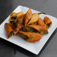 Mirchi Ka Saalan · Curried chili peppers with peanut and poppy seads sauce and simmered in low heat. Usually ac...