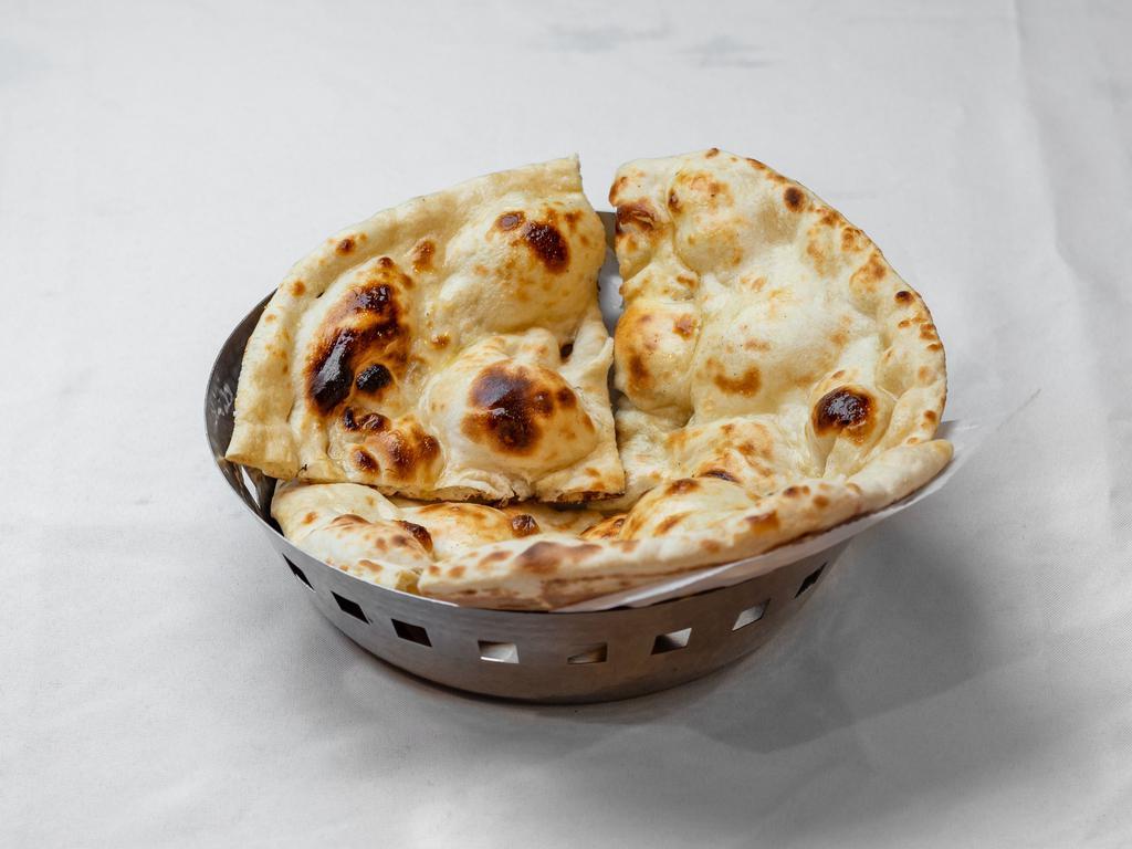 Butter Naan · Leavened bread that is seasoned with fresh butter and baked in tandoor.