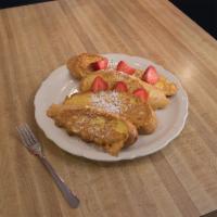 Strawberry French Toast · Thick sliced sourdough cooked light and fluffy then dusted with powdered sugar. Served with ...