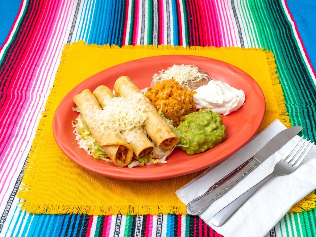 Flauta Dinner · 3 fried corn taquitos beef or chicken served with guacamole, sour cream, rice, beans and lettuce.