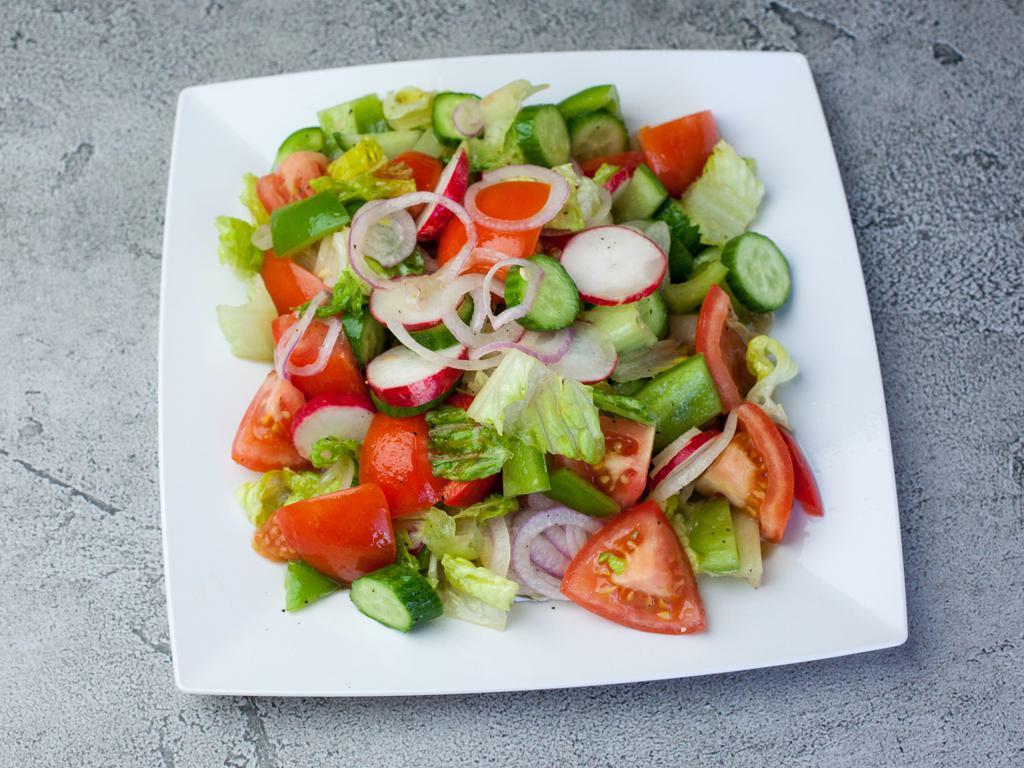 Green Salad · Lettuce, cucumber, tomato, green pepper, red pepper, relish and onion.