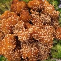 2. Sesame Chicken 芝蔴雞 · Chicken with chef sweet sauce and sesame seed on top. Served with white rice.