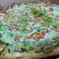 Pesto Pizza · Ricotta cheese and mozzarella in a basil sauce.