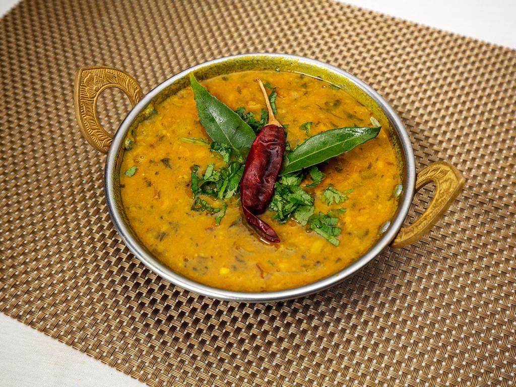 Daal Tadka · Mixed lentils cooked with fresh herbs & spices, sauteed in butter and garnished with fresh coriander.
