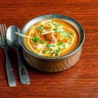 Chicken Tikka Masala · Cubes of white meat chicken Tandoori-style, cooked in a rich creamy tomato sauce.