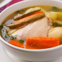 Caldo de Pollo · Chicken and rice stew soup. Served with vegetables. Big and steaming hot. Servido con verdur...
