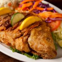 Huachinango Dorado o al Mojo de Ajo · Red snapper, fried or sauteed in a garlic sauce. Served with rice, black beans, and salad. S...