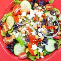 Greek Salad · Fresh crispy romaine and spring mix lettuce topped with cherry tomatoes, cucumbers, chickpea...