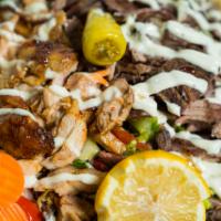 Mr.Shawarma fries · Seasoned fries topped with your choice of beef , chicken or falafel , tahini sauce and / or ...