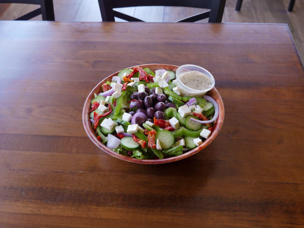 Mediterranean Salad · Romaine lettuce, sun dried tomato, green bell pepper, red onion, Greek olives, feta cheese and cucumber.