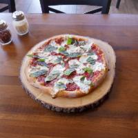 Margherita Pizza · Made with tomato sauce, fresh mozzarella cheese and fresh basil.