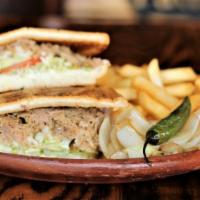 Plancha Torta · Served with choice of meat, mayo, lettuce, tomato, cheese, jalapeños, avocado and fries.