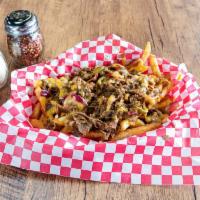 Philly Fries · Steak, grilled onions and spicy peppers, topped with cheddar cheese sauce.